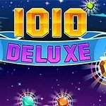 Texten 1010 DELUXE i färgglada, blockformade bokstäver mot en stjärnhimmel med glittrande juveler runtom