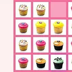 En rosa rutnät med olika cupcakes i olika färger och dekorationer