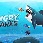 En illustration av en haj med gapande käftar omgiven av korallrev och färgglada fiskar under vattenytan, med texten Angry Sharks
