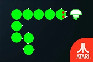Grön orm med röda ögon rör sig mot en vit svampikon på svart bakgrund med Atari-logotypen