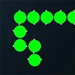 Grön orm med röda ögon rör sig mot en vit svampikon på svart bakgrund med Atari-logotypen
