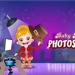 Tecknad flicka på fotosession med kamera och ljusrigg i bakgrunden, samt texten Baby Hazel Photoshoot