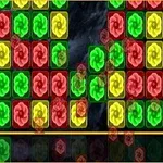 Färgglada block med rosettliknande symboler i rött, grönt och gult ligger arrangerade i ett rutnät