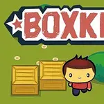 En tecknad figur med rött hår och röd tröja står bredvid två träboxar framför en grön buske, med texten BOXKID ovanför