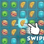 Ett pusselspel med färgglada ikoner i ett rutnät och en hand som pekar mot en ikon med texten SWIPE