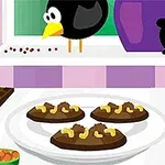 En tecknad bild med kakor på ett fat, en fågel vid fönstret och ingredienser på köksbänken