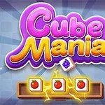 Texten Cube Mania i lila och gult med tärningar och frukter mot en rutmönstrad bakgrund med ljuseffekter
