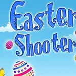 Texten Easter Shooter i blå bokstäver mot en himmelblå bakgrund med moln, dekorerade påskägg och en gul fjäril