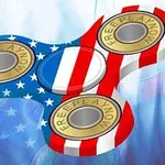 En fidget spinner med amerikanska flaggans mönster och texten FREEPLAYNOW på lagren