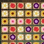 Ett rutnät av färgglada blommor i olika färger och former som är ordnade i rader och kolumner
