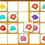 Ett rutnät av blommor i olika färger på en spelbräda