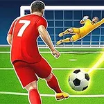 En fotbollsspelare i röd tröja sparkar en boll mot mål medan målvakten i gult dyker för att rädda