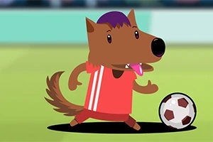 En tecknad varg i röd fotbollsklädsel dribblar med en fotboll på en grön plan