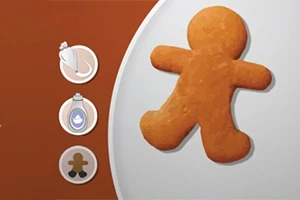Pepparkaksfigur på en tallrik med tre ikoner i en meny till vänster