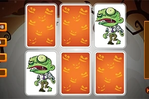 En tecknad grön zombiefigur i en uppsättning av kort med orange bakgrund dekorerad med halloween-inspirerade ansikten