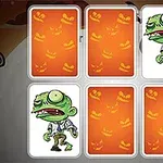 En tecknad grön zombiefigur i en uppsättning av kort med orange bakgrund dekorerad med halloween-inspirerade ansikten
