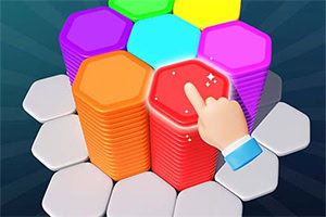 En hand pekar på en hög med flerfärgade hexagoner staplade på varandra