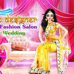 En kvinna klädd i en gyllene saree sitter på en soffa med färgglad bakgrund