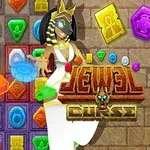 En anubismaskerad figur står framför ett rutnät med färgglada juveler och mönster, med texten Jewel Curse i förgrunden