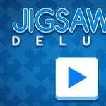 Texten Jigsaw Deluxe i blått med en pusselbitsikon och en play-knapp på blå bakgrund