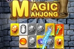 Block med färgglada ädelstenar och brädetext Magic Mahjong mot en bakgrund av stenar