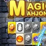 Block med färgglada ädelstenar och brädetext Magic Mahjong mot en bakgrund av stenar