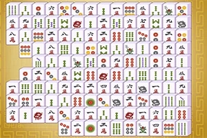 Ett bräde med en uppsättning mahjong-brickor arrangerade i rader och kolumner