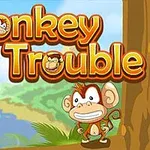 Tecknad apa står vid stranden, omgiven av träd och grönska, med texten Monkey in Trouble ovanför