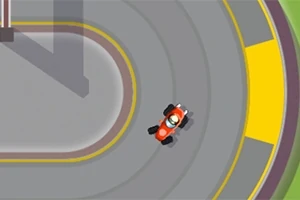 En röd go-kart kör runt en kurva på en asfalterad bana med gula markeringar