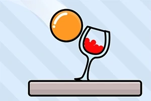 En orange boll faller mot ett vinglas med röd vätska på ett brunt underlag