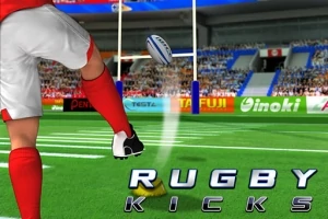 En spelare i röd uniform sparkar en rugbyboll på en grön plan med en stadion i bakgrunden