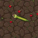 En pixelorm rör sig över en stenig yta och äpplen är utspridda