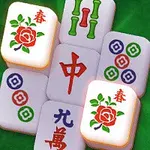 Mahjongblock med blom- och cirkelsymboler på en grön bakgrund
