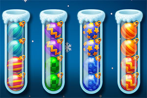 Fyra glasrör fyllda med färgglada, mönstrade bollar mot en blå bakgrund med snöflingor