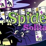 En tecknad bild med en häxa, en spindel och spelkort i bakgrunden