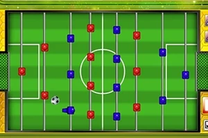 Ett bordfotbollsspel med röda och blå spelpjäser och en fotboll på en grön plan