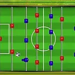 Ett bordfotbollsspel med röda och blå spelpjäser och en fotboll på en grön plan