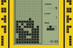 Gul handhållen spelkonsol med blockgrafik på skärmen som visar staplade block och poängräkning
