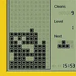 Gul handhållen spelkonsol med blockgrafik på skärmen som visar staplade block och poängräkning