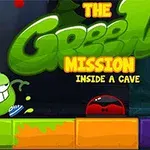 En grön tecknad figur med skor och ett brett leende står bredvid en text som säger The Green Mission Inside a Cave, med färgglada block i förgrunden