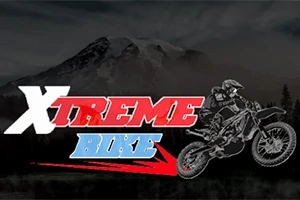 Logotyp för XTREME BIKE med en motorcyklist som utför ett hopp mot en bergsbakgrund