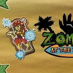 Tecknad zombiefigur vid stranden med palmer och texten Zombies at the Beach mot en brun bakgrund